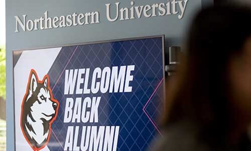 A screen that says "Welcome Back Alumni" and shows the Northeastern husky logo