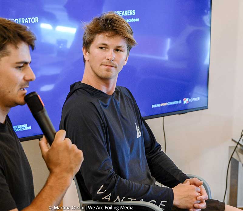 Nicolai Jacobsen listens to a speaker giving a presentation