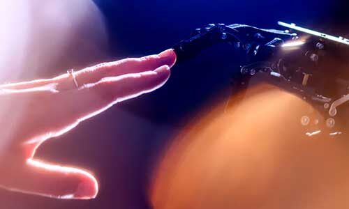 A human hand and robotic hand reach toward one another