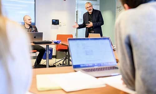 Alessandro Vespignani presents research in a conference room