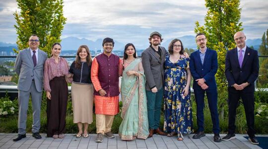 Kalhar Pandya (fourth from left) and Mansi Modi (fifth from left) at their wedding, joined by faculty from Northeastern’s Vancouver campus