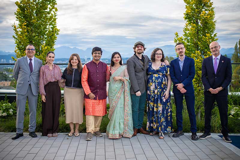 Kalhar Pandya (fourth from left) and Mansi Modi (fifth from left) at their wedding, joined by faculty from Northeastern’s Vancouver campus