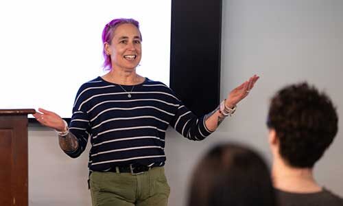 Northeastern professor Dr. Laney Strange gives the Last Lecture address to students and their families in the Curry Student Center.