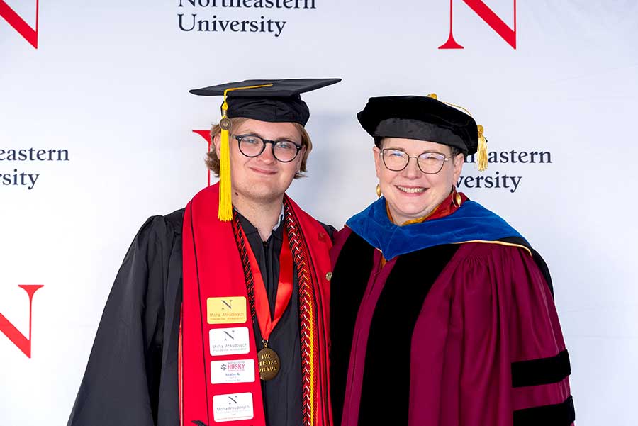 Khoury graduate Misha Ankudovych (left) stands with Khoury Dean Beth Mynatt