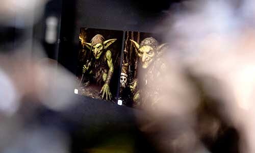 a computer screen showing an image of two green goblins