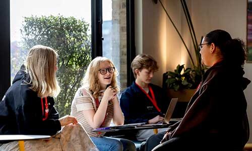 Students on Northeastern’s London campus have a discussion.