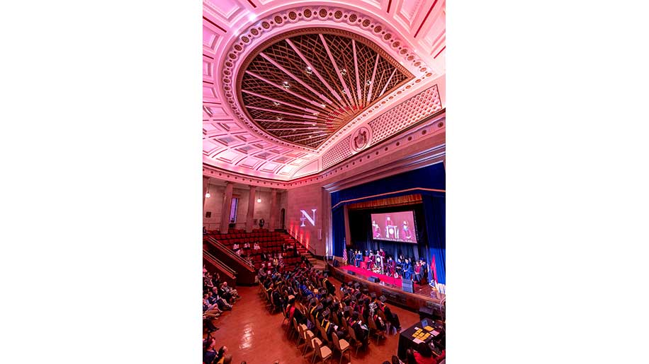 A view of the graduates, stage and classic ceiling of the George Washington Masonic National Memorial Hall in Alexandria, which dates back to 1910