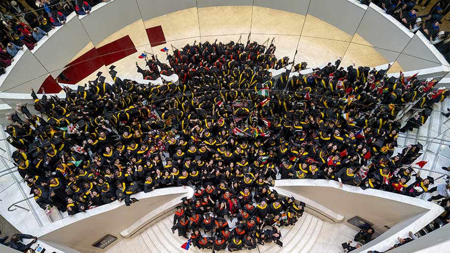 An overhead view of about 250 Northeastern Vancouver students celebrating Convocation 2026 at the Centre for the Performing Arts in Vancouver, BC. Photos by Jimmy Jeong.