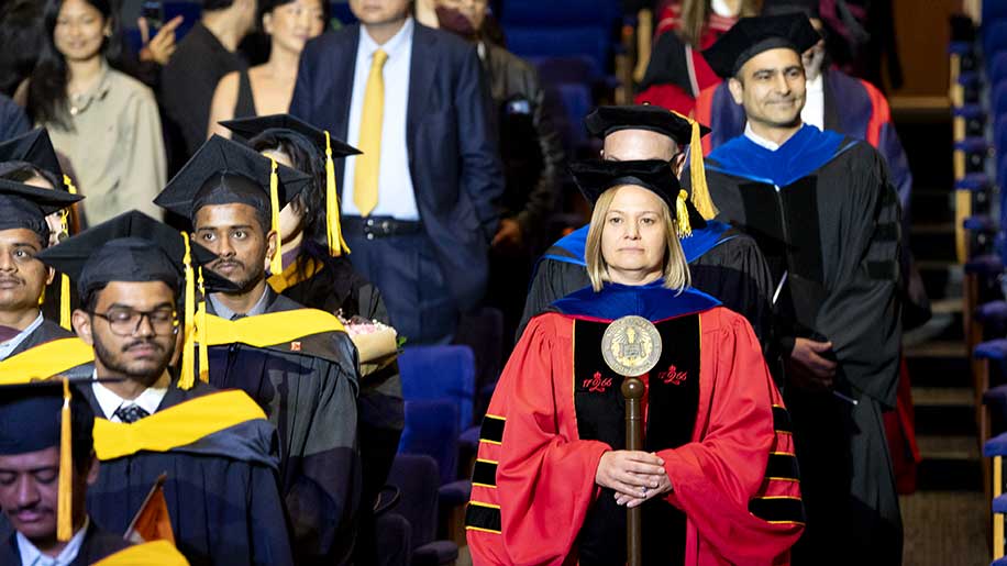 Among the faculty in the Convocation procession were Bethany Edmunds, associate dean of computing programs - West Coast.
