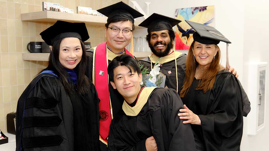Three Khoury graduates post with Northeastern faculty