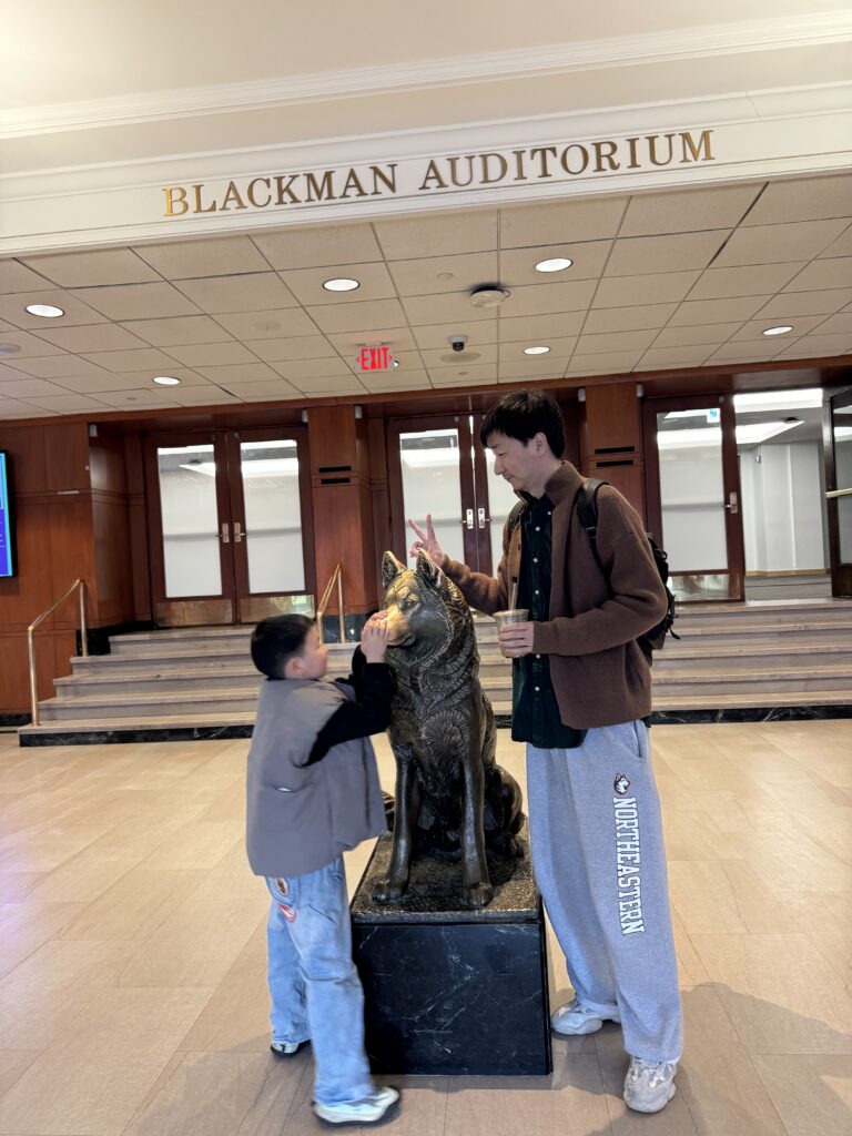 Denfeng “Jackie” Jiang and his son in Ell Hall at the Northeastern Boston campus