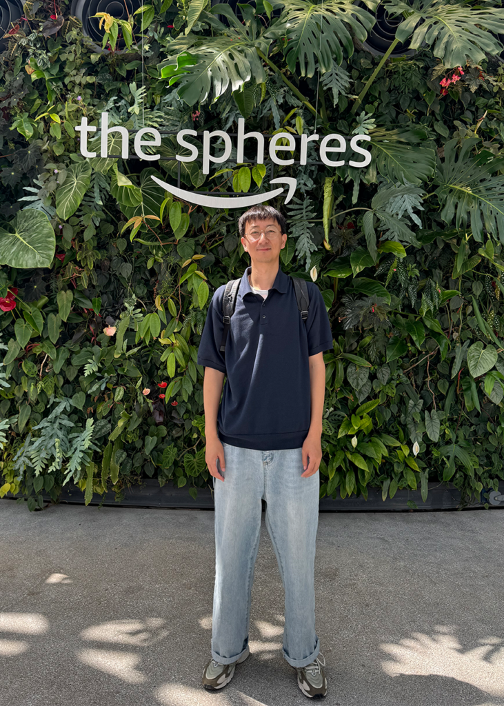 A shot of Denfeng “Jackie” Jiang with an Amazon-like logo that reads "the spheres."