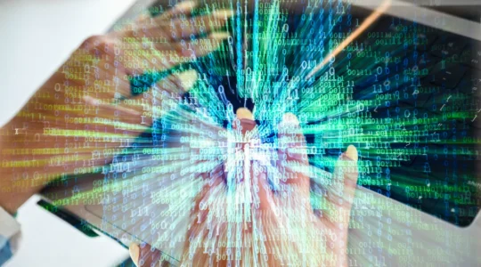 hands around a screen with flashing text to depict AI