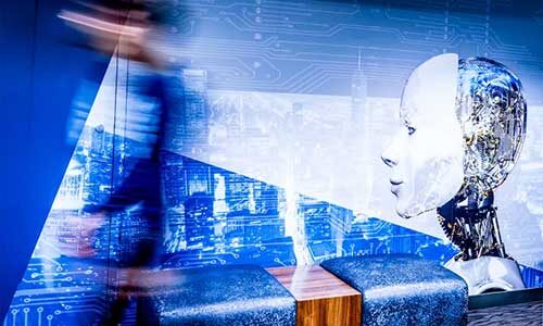 An artistic graphic showing a robotic head viewing a blurred person walking by.