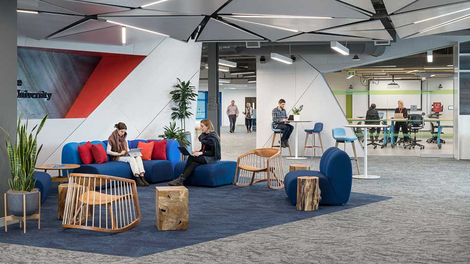Students working in between classes in one of the Roux's many open collaboration spaces.